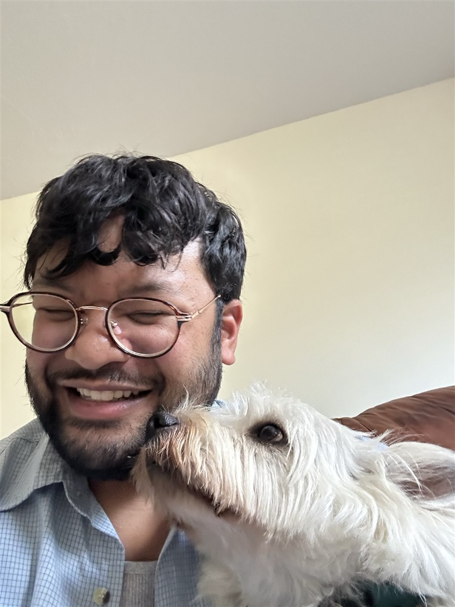 The maker behind Decoupage Studio relaxing with Finn, his white dog